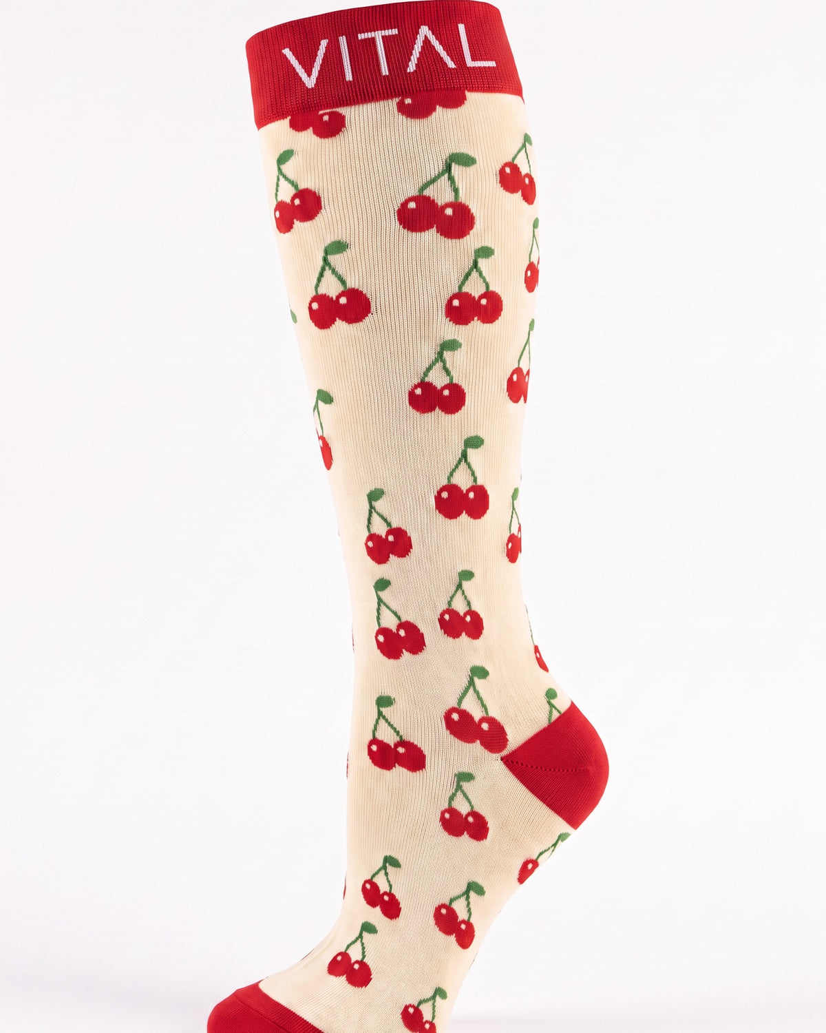Cherry Pop knee-high compression sock, cherry print and red logo cuff, studio shot on white