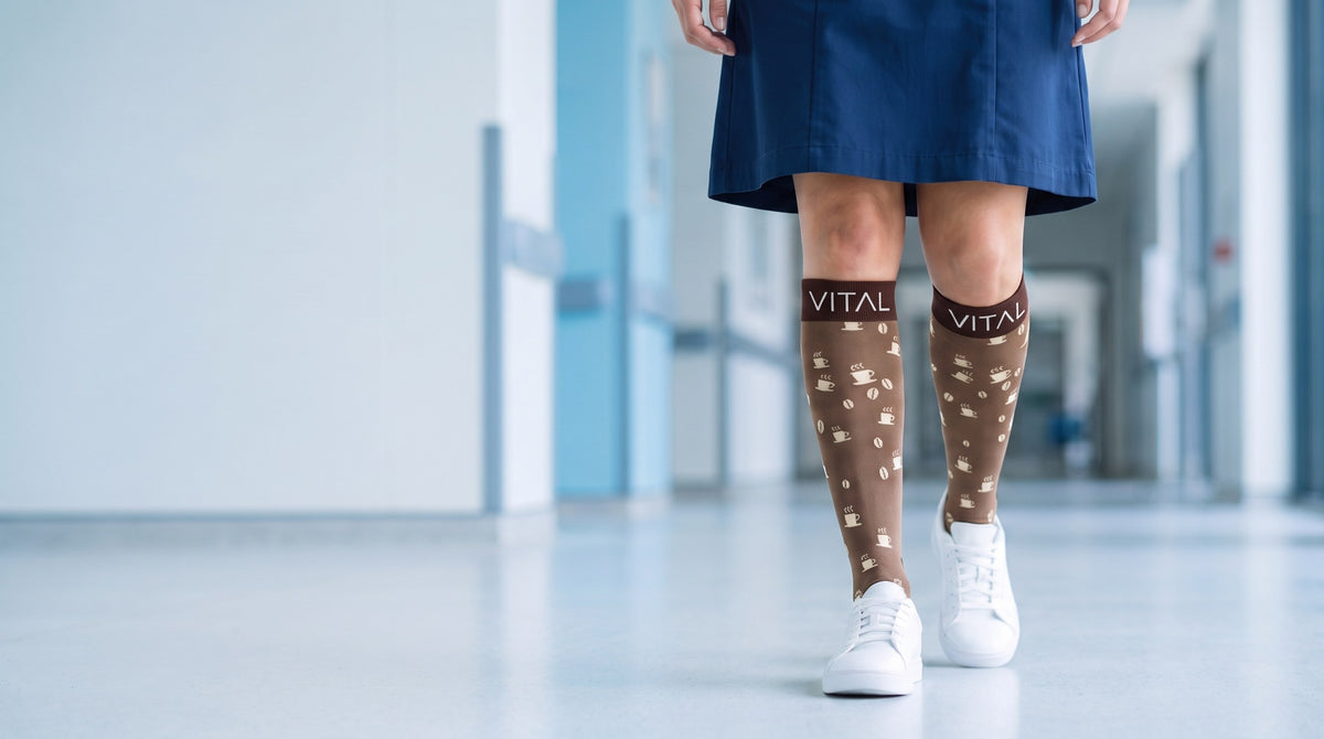 Espresso knee-high compression socks, navy dress and white sneakers, walking down a bright corridor